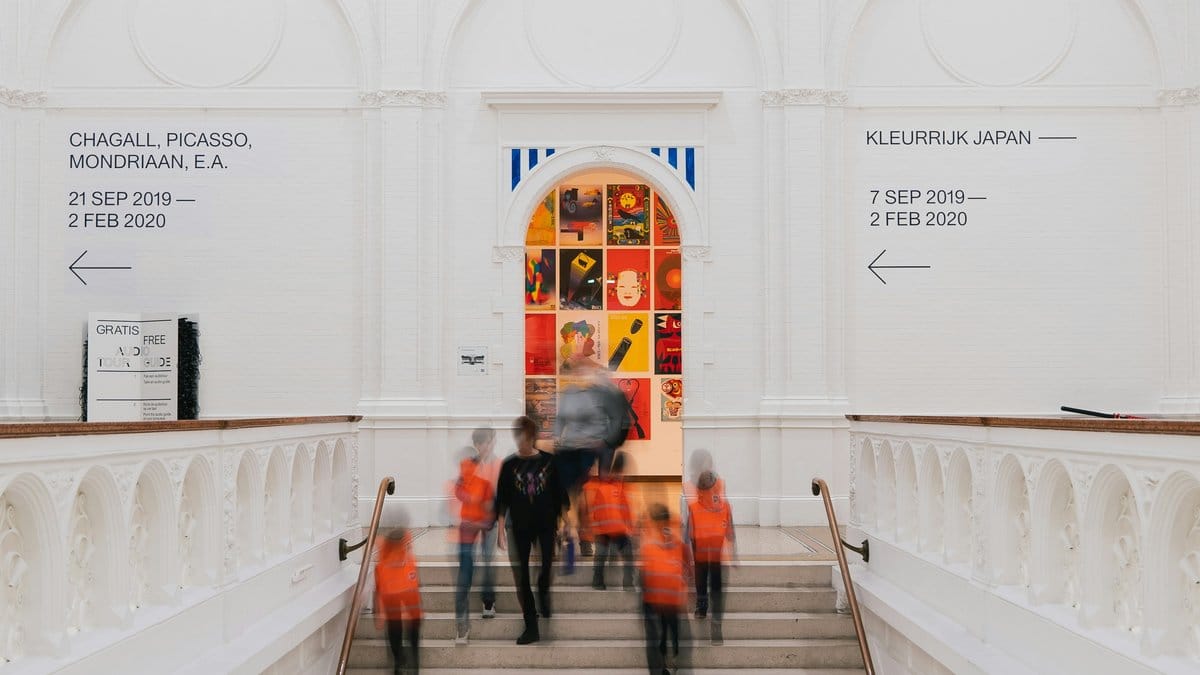 Museum entrance hall with signage for Chagall Picasso and Mondrian exhibitions