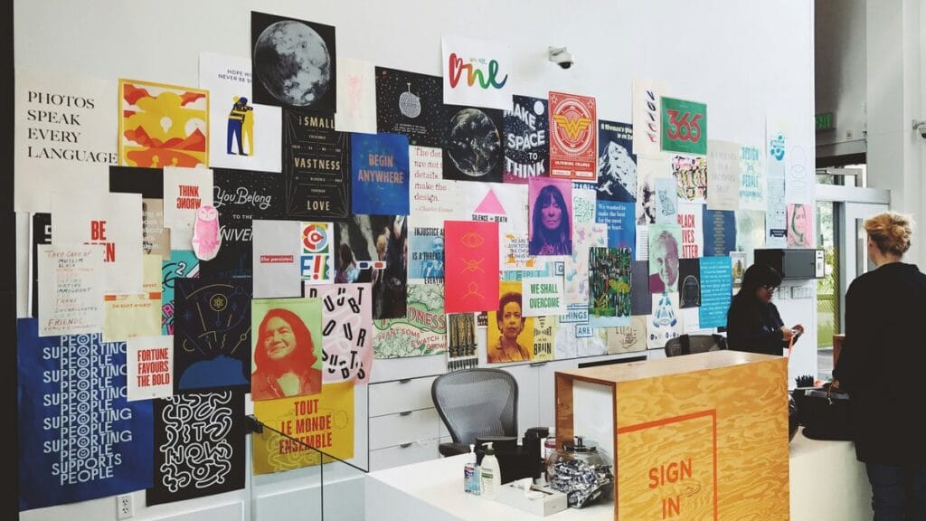 Wall of art prints and posters in a creative studio — how to choose art prints