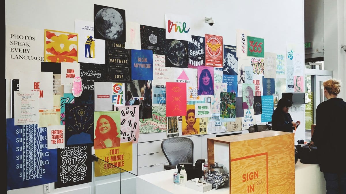 Wall of art prints and posters in a creative studio — how to choose art prints
