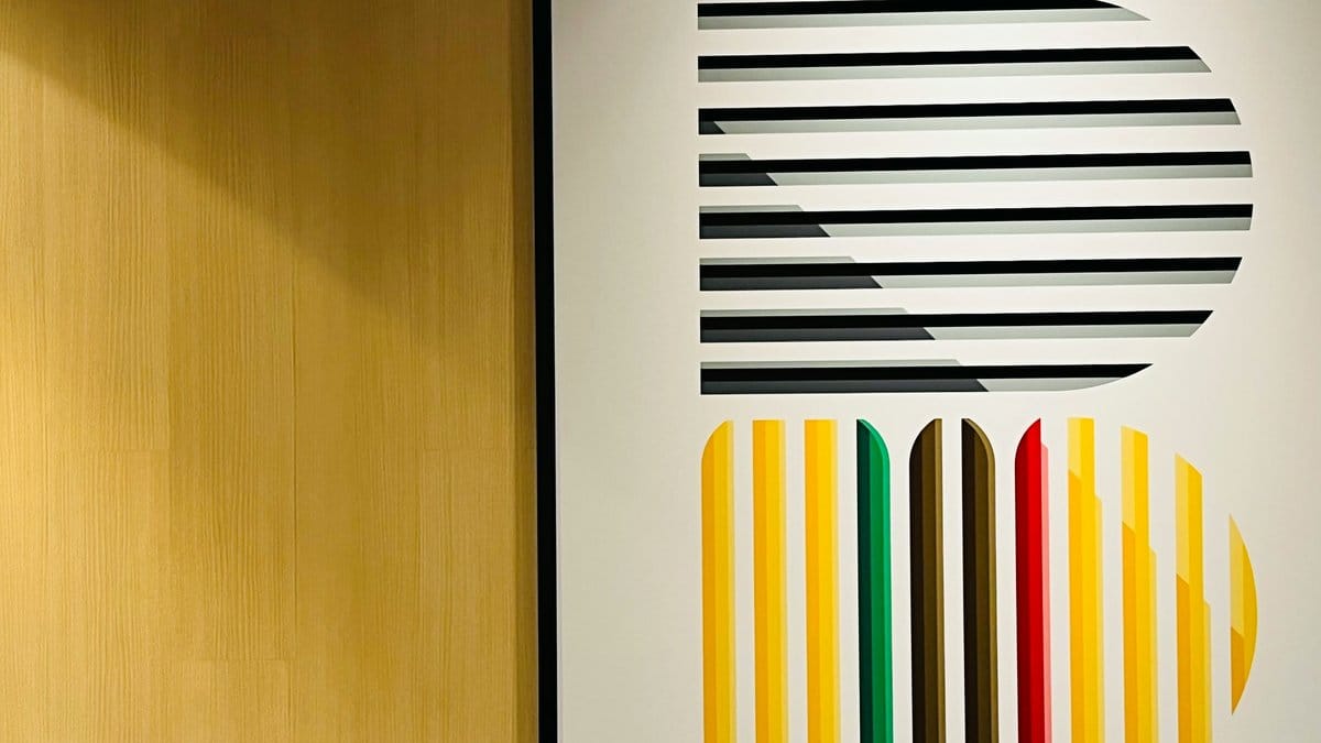 Geometric stripe art installation in yellow green red and black — Italian graphic design