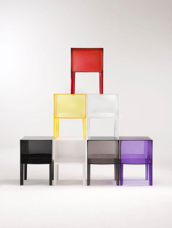 Kartell Small Ghost Buster side tables in red, yellow, black, and purple, designed by Philippe Starck