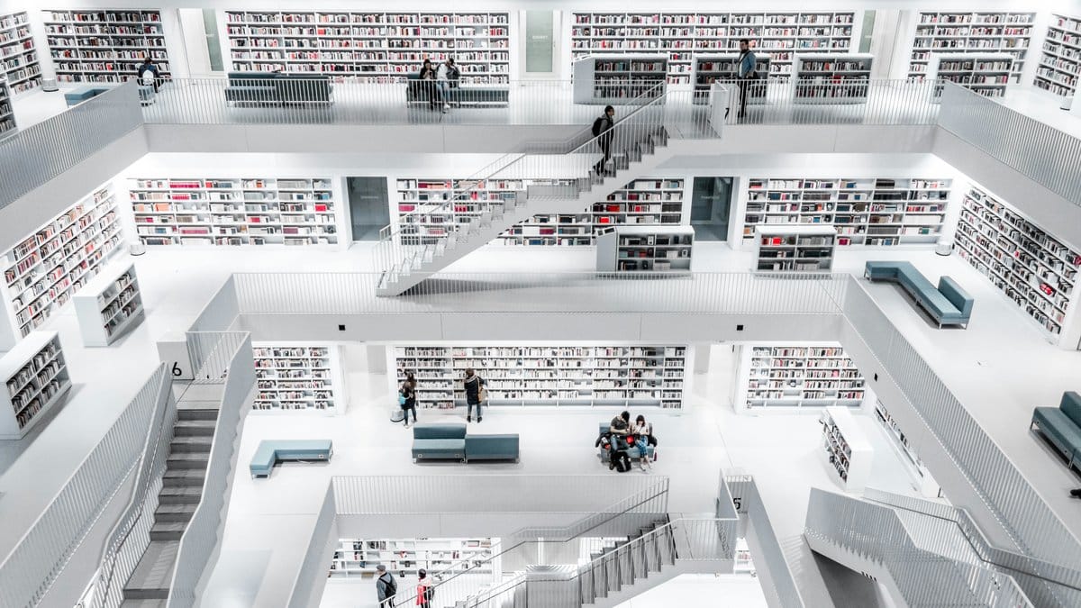 Modern multilevel white library interior — knowledge and design research