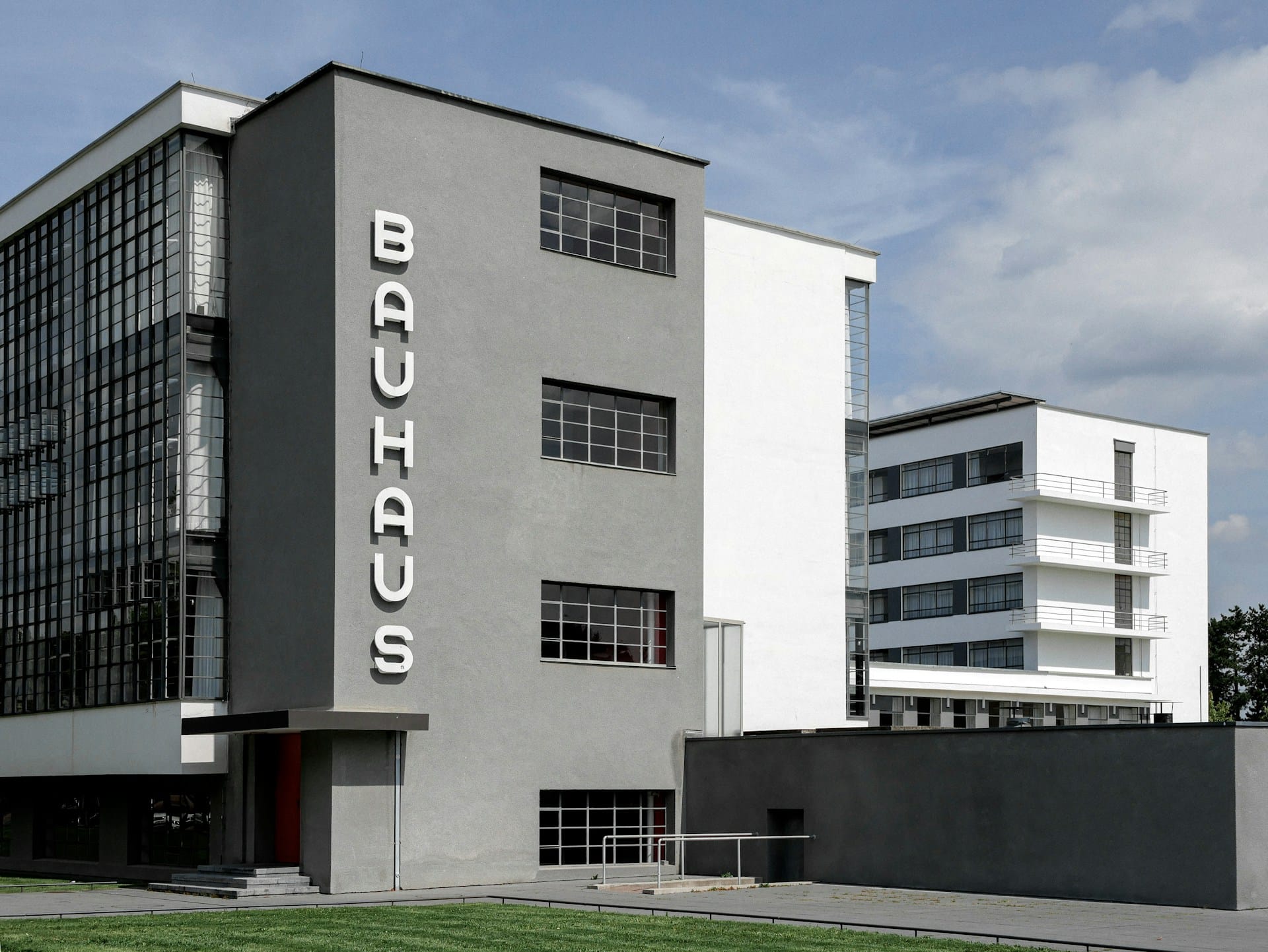 The Bauhaus building in Dessau, designed by Walter Gropius in 1926, showing the glass curtain wall of the workshop wing