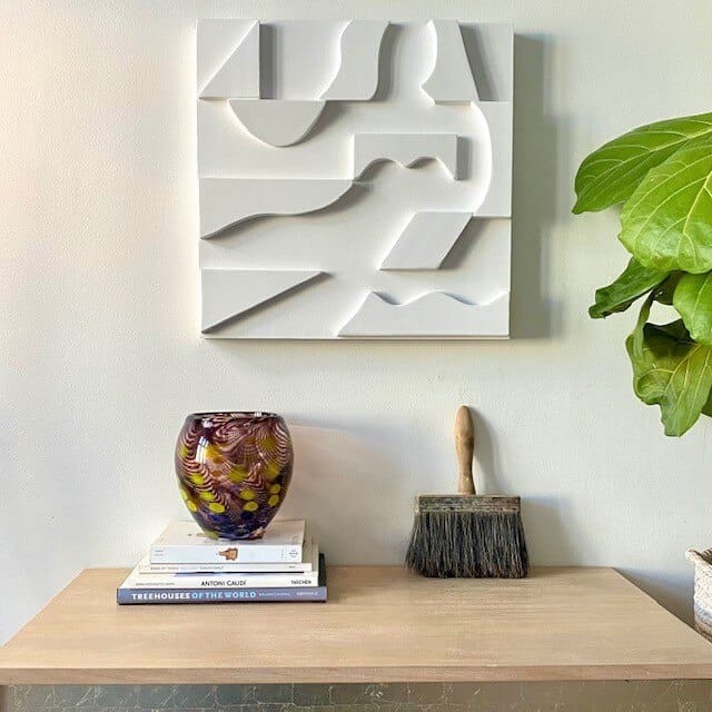 Femme Allongee sculpture in a Scandinavian modernist interior, showing the integration of art and functional design