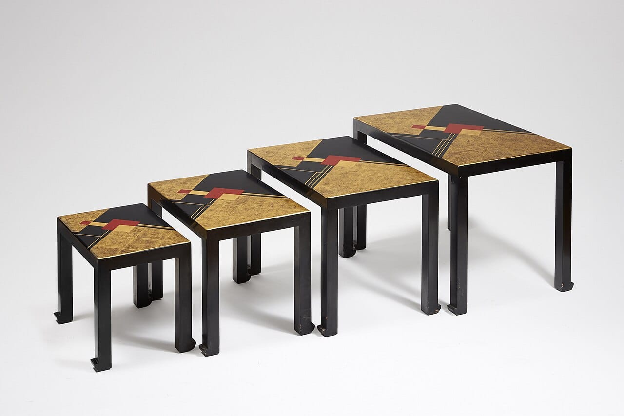 Gaston Suisse nesting tables in black and gold lacquer, 1932