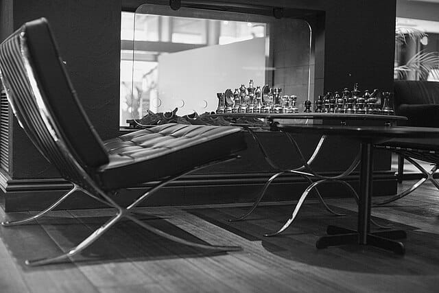 Barcelona chair in a contemporary hotel lobby interior, Hotel Haven Helsinki, showing the chair in a real-world setting