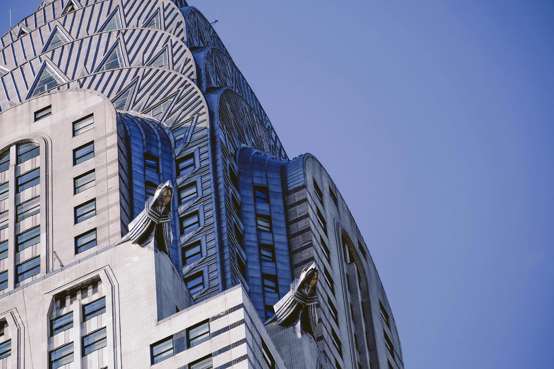 The stainless steel crown of the Chrysler Building, New York, 1930, designed by William Van Alen — eagle gargoyles based on 1929 Chrysler hood ornaments