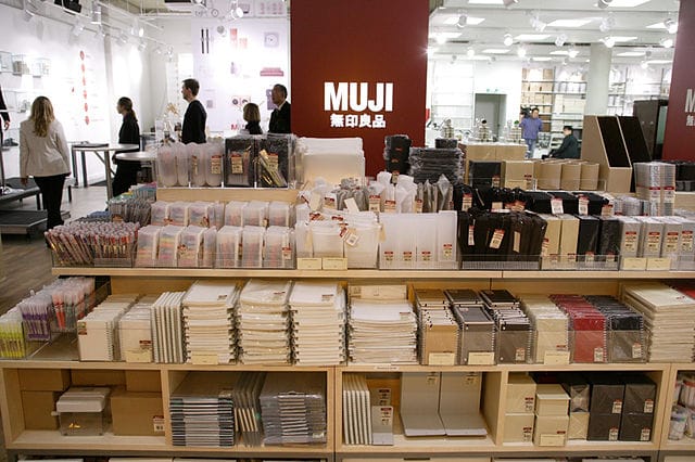 Muji store interior with polypropylene storage units on display shelves, Düsseldorf
