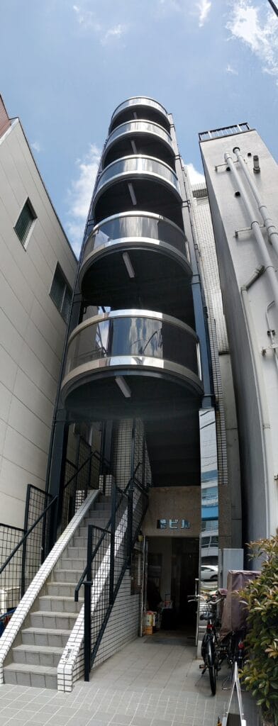 Narrow building with rounded balconies Shibuya Tokyo