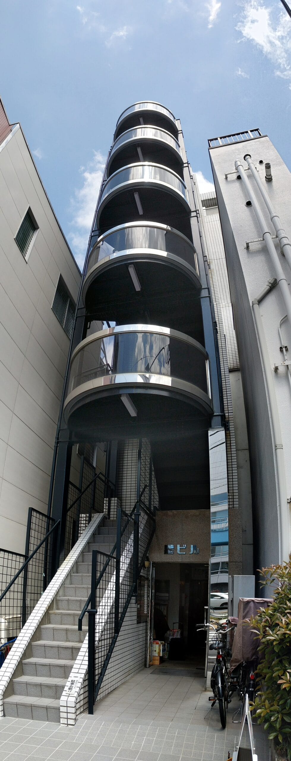 Narrow building with rounded balconies Shibuya Tokyo