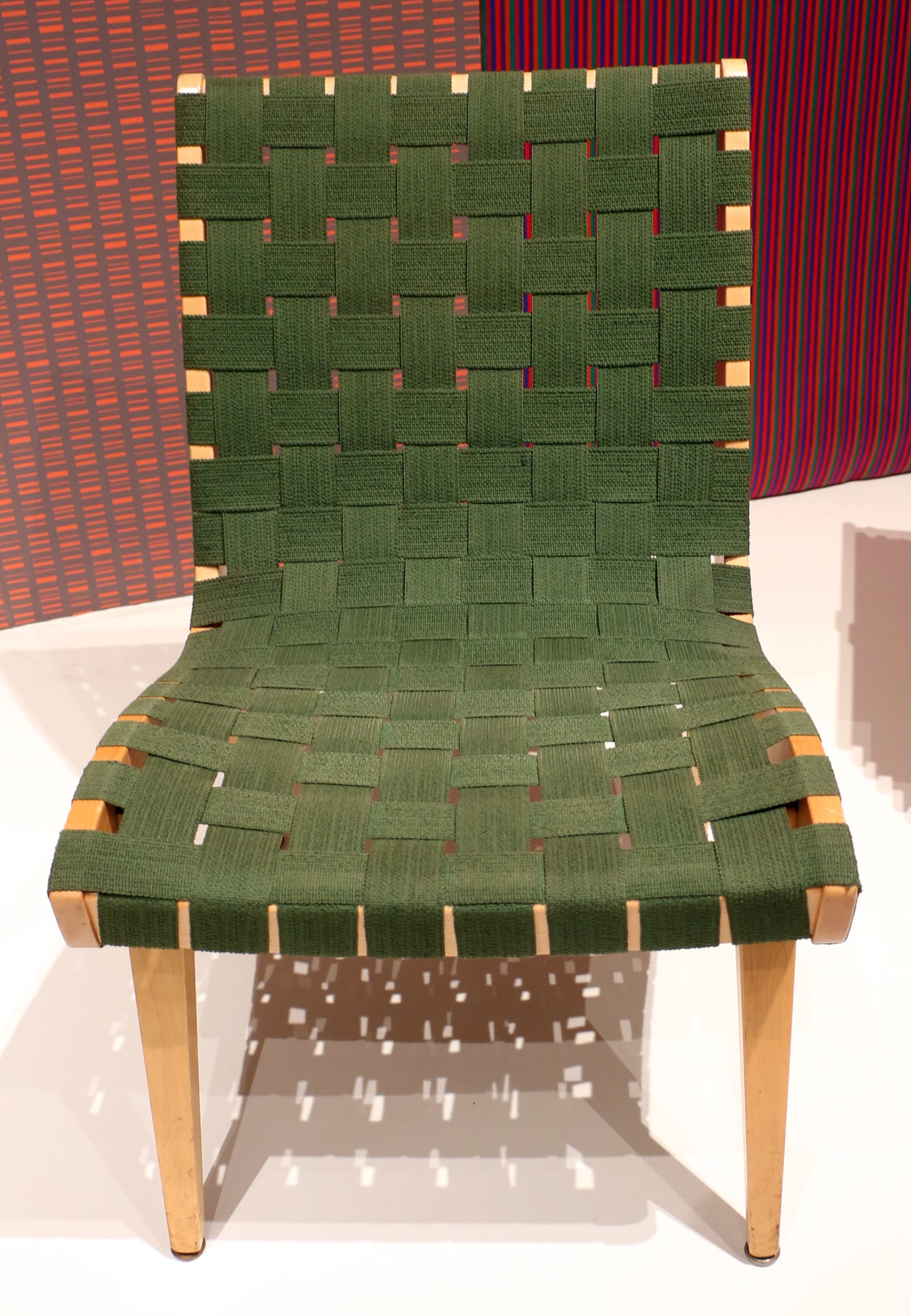 Jens Risom Model 654W lounge chair with walnut frame and woven cotton webbing, designed 1941 for Knoll