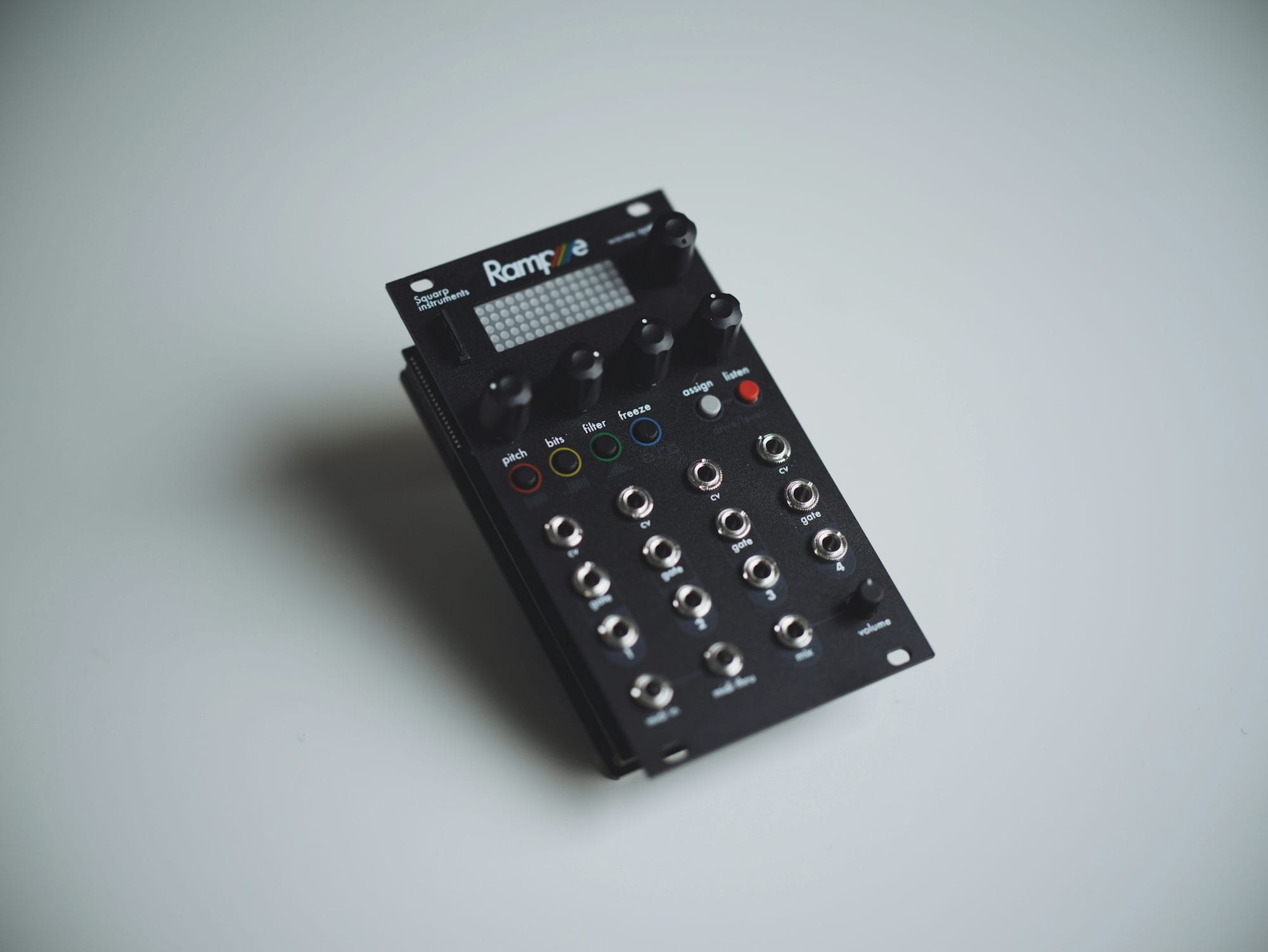 Electronic music instrument with knobs and controls showing minimal industrial design