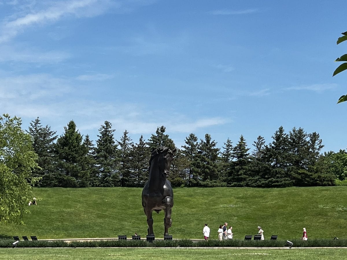 The American Horse seen across the lawn at Frederik Meijer Gardens, the 24-foot bronze in its Grand Rapids landscape