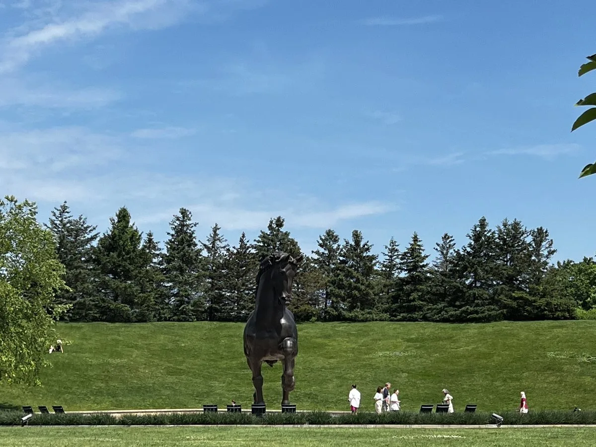 The American Horse seen across the lawn at Frederik Meijer Gardens, the 24-foot bronze in its Grand Rapids landscape