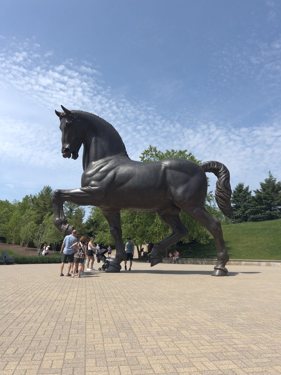 Full view of The American Horse bronze installed at grade on the plaza at Frederik Meijer Gardens, Grand Rapids, Michigan