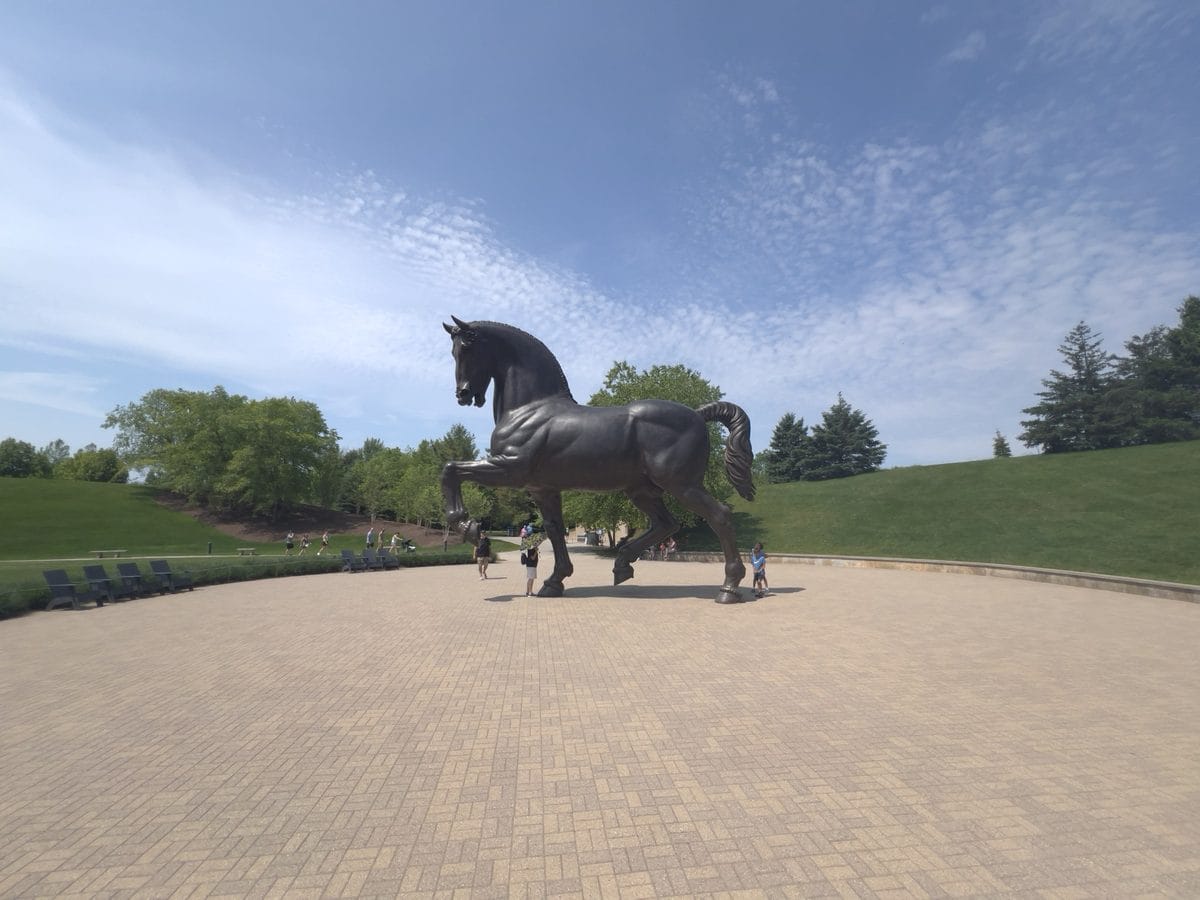 Side view of The American Horse by Nina Akamu, the 24-foot bronze at Frederik Meijer Gardens in Grand Rapids, Michigan